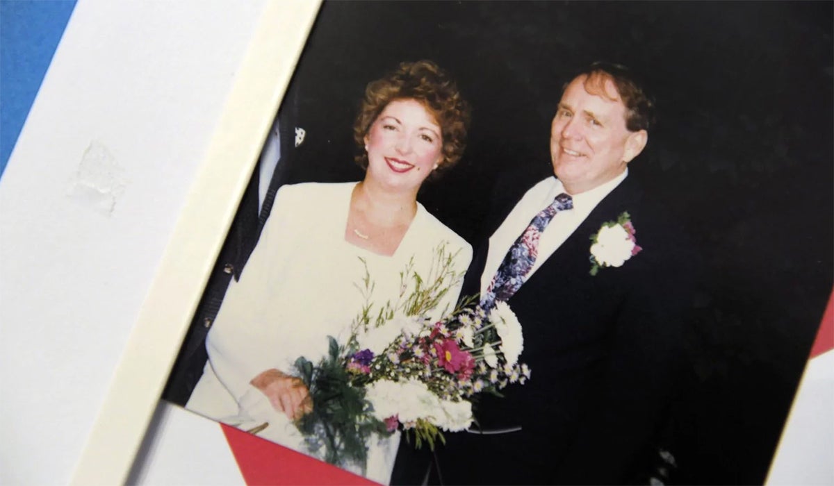 A photograph album shows Sarah Harris and her husband, Ernie, on their wedding day